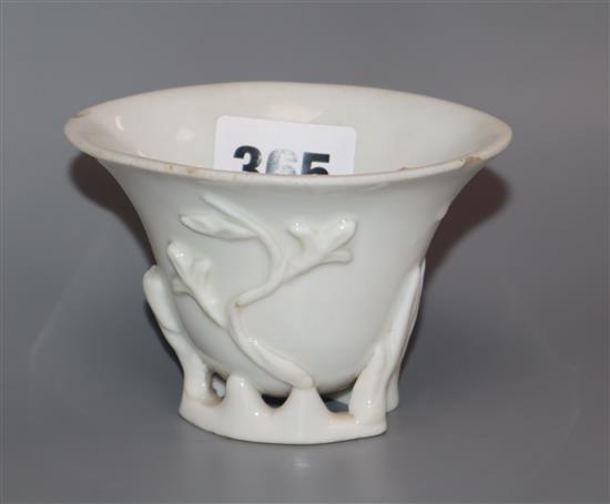 An 18th century Chinese blanc de chine prunus libation cup